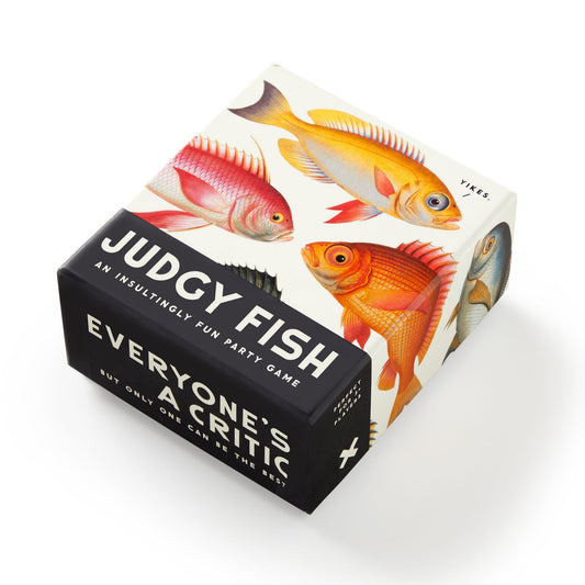 The Judgy Fish Game by Brass Monkey comes in a box with colorful illustrated fish on the lid and the tagline: “An insultingly fun insults game. Everyone’s a critic. But only one can be the best.”.