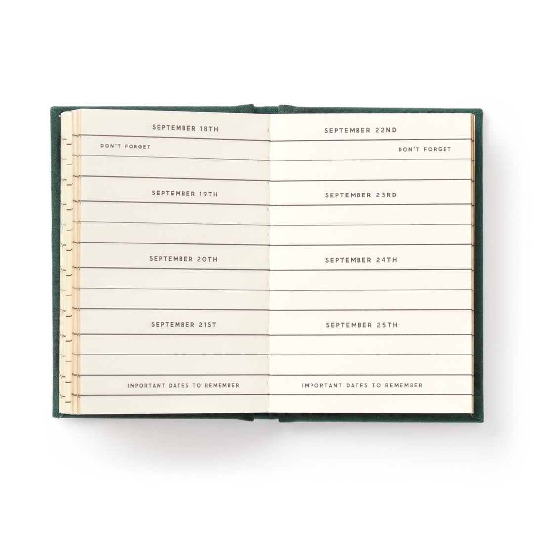 An open hard-bound Dates People Get Mad If I Forget Tiny Diary by Brass Monkey shows a week from September 18th to 25th, each date on its own line with reminders like DONT FORGET and IMPORTANT DATES TO REMEMBER beneath the dates.