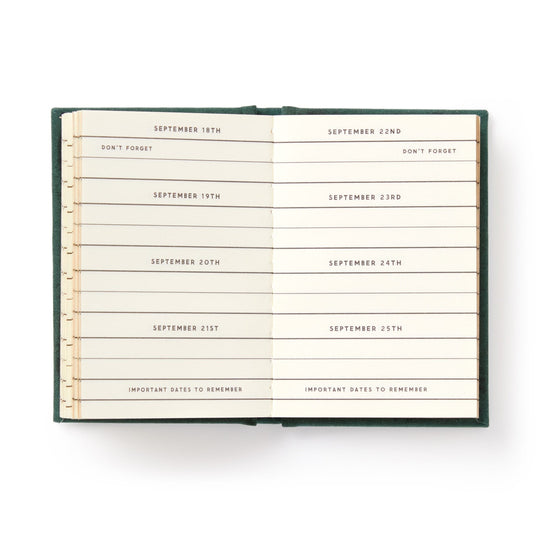 An open hard-bound Dates People Get Mad If I Forget Tiny Diary by Brass Monkey shows a week from September 18th to 25th, each date on its own line with reminders like DONT FORGET and IMPORTANT DATES TO REMEMBER beneath the dates.