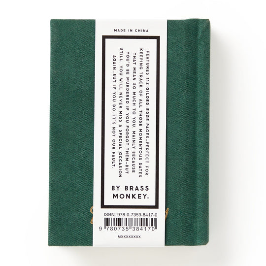 A small, hard-bound green Dates People Get Mad If I Forget Tiny Diary by Brass Monkey with a white back label describing its use for organizing murder mysteries and an ISBN barcode at the bottom.