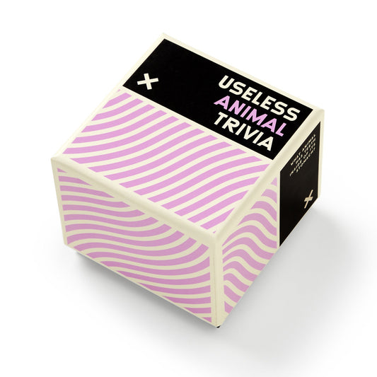 Brass Monkey’s Useless Animal Trivia features a black-and-white label with purple wavy lines—perfect for fans of quirky animal facts and fun trivia.