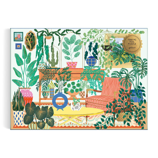 Illustration from the Faye Guanipa Houseplant Haven 1000 Piece Foil Puzzle: a cozy room with lush potted plants, a red-striped armchair, yellow rug, wall art, and a cat—capturing a vibrant indoor jungle scene.