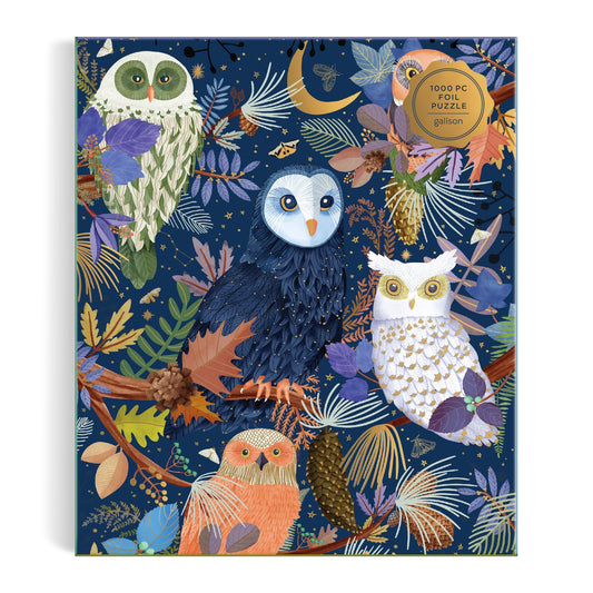 The Mara Penny "Owls at Dawn" 1000 Piece Foil Puzzle features a whimsical, intricate illustration of four colorful owls perched among autumn leaves on a dark blue background.