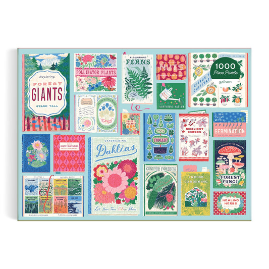 The Ever Upward Botanist Bookshelf 1000 Piece Puzzle by Emily Taylor features a vibrant collage of illustrated seed packets with flowers, plants, ferns, nuts, fungi, and playful botanical designs in various fonts.
