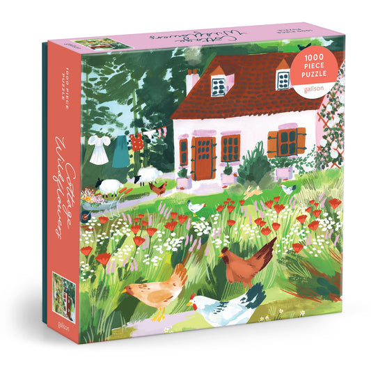 The Cottage Wildflowers 1000 Piece Puzzle by Joanna Clay features a charming illustration of a red-roof cottage surrounded by colorful garden flowers, chickens, and trees—capturing countryside beauty. Comes in a square box.