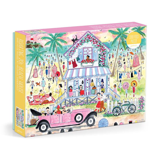 The Michael Storrings Roaring 20s Beach House 1000 Piece Puzzle features a vibrant beach scene with people in vintage outfits, a pink stilt house, palm trees, and a classic pink convertible.