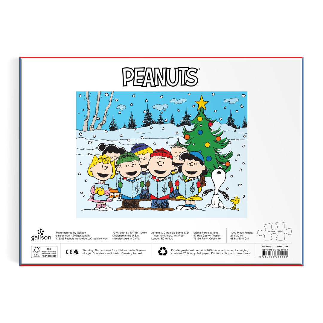 The Peanuts Christmas Caroling 1000 Piece Puzzle by Peanuts Worldwide, LLC features the characters singing in the snow by a decorated tree with Snoopy, under the word PEANUTS—a charming holiday scene perfect for fans.