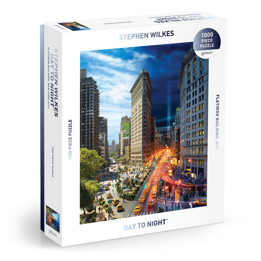 The Stephen Wilkes Day To Night Flatiron 1000 Piece Puzzle by Stephen Wilkes features his iconic NYC Flatiron image, transitioning seamlessly from day to night in a single stunning scene.