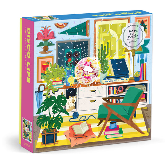 The Disco Life 500 Piece Foil Puzzle by EurekartStudio features a vibrant living room scene with plants, a green chair, books, a sparkling disco ball, and retro decor for cozy charm.