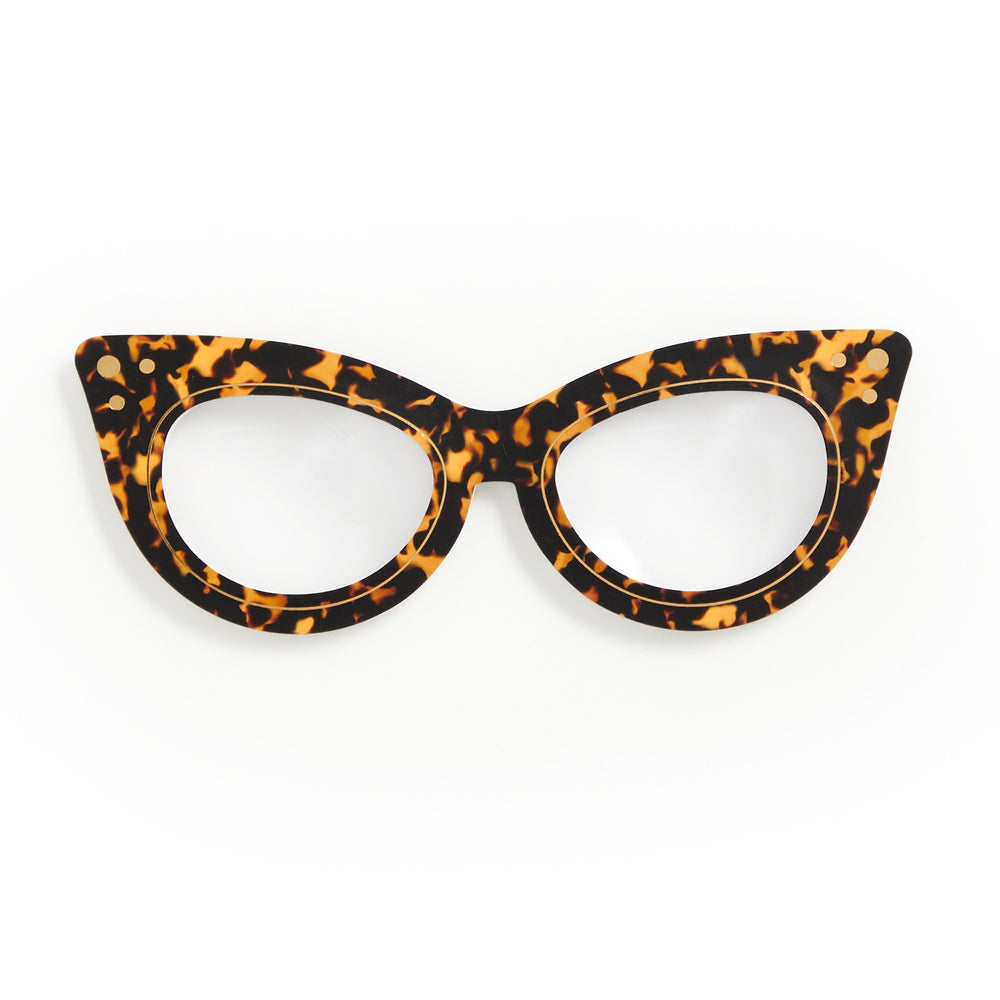The Galison Cat Eye Readers Bookmark with Magnifier features a chic black and amber tortoiseshell pattern on a white background—ideal as a stylish accessory or unique bookmark.
