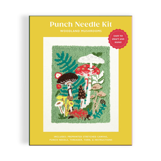 The Anja Riebensahm Woodland Mushrooms Punch Needle Kit features a colorful mushroom and plant design on the box and includes a canvas, punch needle, threads, yarn, and instructions.