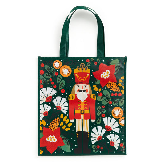 The Merry Nutcracker Reusable Shopping Bag by Sandra Hutter features a vibrant Nutcracker soldier with festive flowers on a dark green background—ideal for carrying your holiday artwork or gifts.