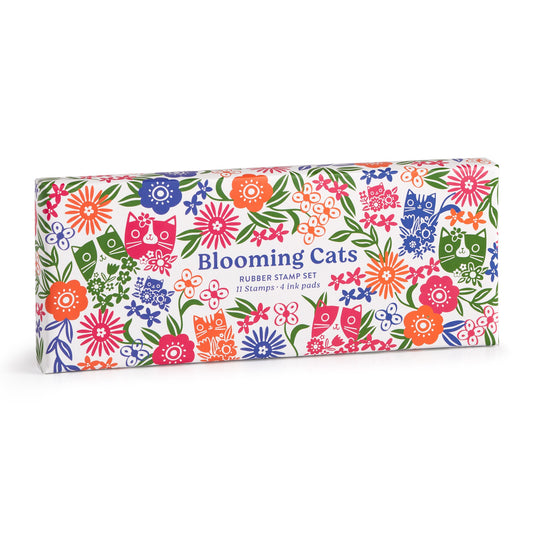 A rectangular box by Tara Lilly features cat and floral designs with Blooming Cats Rubber Stamp Set, 11 Stamps + 4 Ink Pads in blue and pink text.