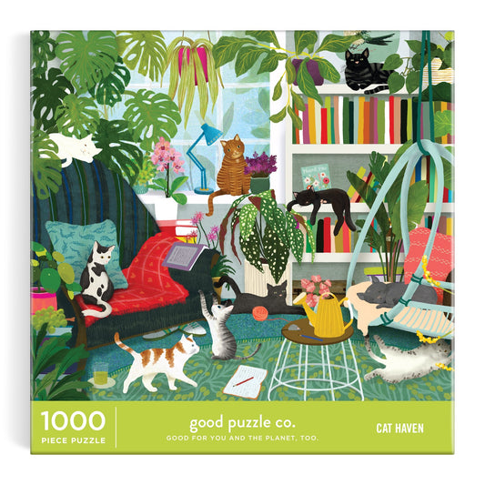 The Good Puzzle Co. Cat Haven 1000 Piece Puzzle by Katherine Quinn features a vibrant illustrated box with a cozy room, plants, books, and ten playful cats. Made from recycled materials.