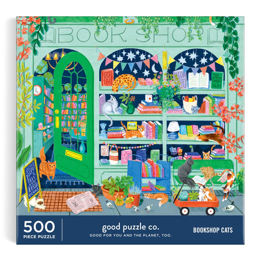 Colorful bookshop scene with cats, plants, and books. Good Puzzle Co. Bookshop Cats 500pc Puzzle by Lee Foster-Wilson—eco-friendly and made from recycled materials.