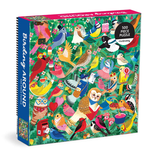 The Birding Around 500 Piece Puzzle by Rebecca Jones features vibrant artwork of birds with accessories on a leafy background, perfect for bird lovers and puzzle enthusiasts.