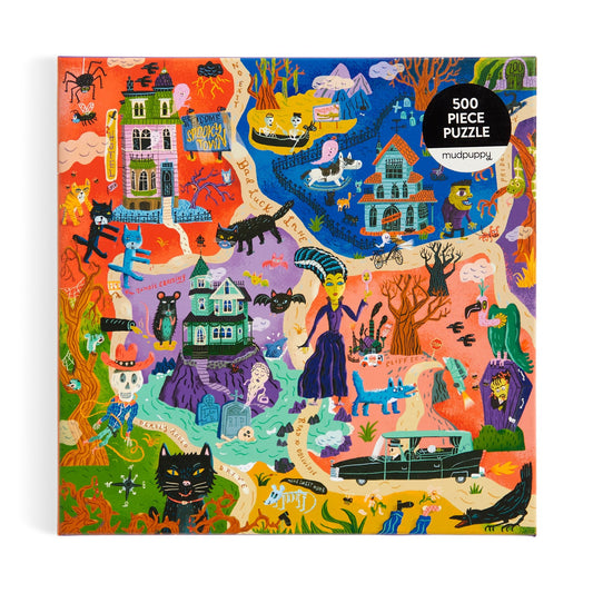 The Welcome to Spooky Town 500 Piece Puzzle by Stephanie Birdsong features a vibrant Halloween scene with haunted houses, skeletons, bats, witches, pumpkins, monsters, a black cat, and spooky scenery.