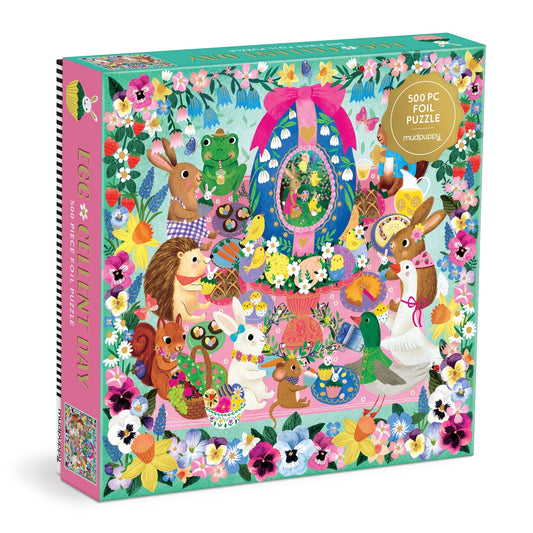 Rebecca Jones’ Egg-cellent Day 500 Piece Foil Family Puzzle features a vibrant tea party with rabbits, a hedgehog, squirrel, and frog among festive Easter decorations—ideal for family holiday fun.