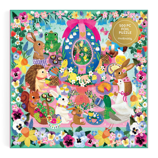 The Rebecca Jones Egg-cellent Day 500 Piece Foil Family Puzzle is a vibrant Easter puzzle, featuring rabbits, a hedgehog, frog, and duck around a decorated egg amid flowers and treats, framed by a border of colorful blooms.