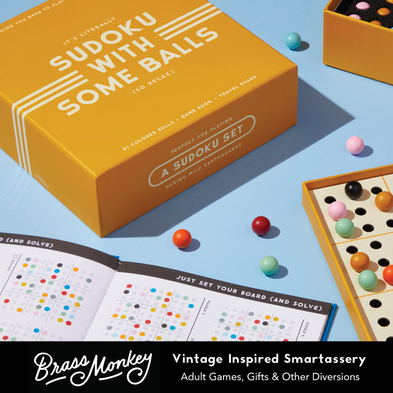 A yellow box labeled “Sudoku With Some Balls” sits beside an open Sudoku game board with colorful balls and a puzzle booklet. The scene promotes a vintage-inspired adult game set by Brass Monkey.