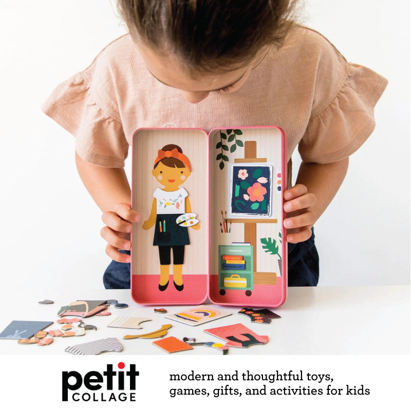 A child holds an open pink magnetic playset featuring a magnetic doll dressed as an artist, surrounded by mix-and-match clothing pieces and art studio accessories. Petit Collage branding and slogan appear at the bottom.