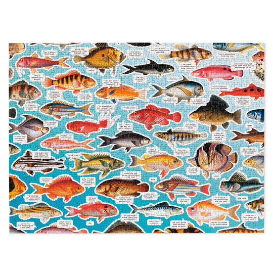 The Judgy Fish 1000 Piece Puzzle by Brass Monkey features spot UV illustrations of colorful fish, each labeled with its name and description on a blue-white background, and is made from recycled materials.
