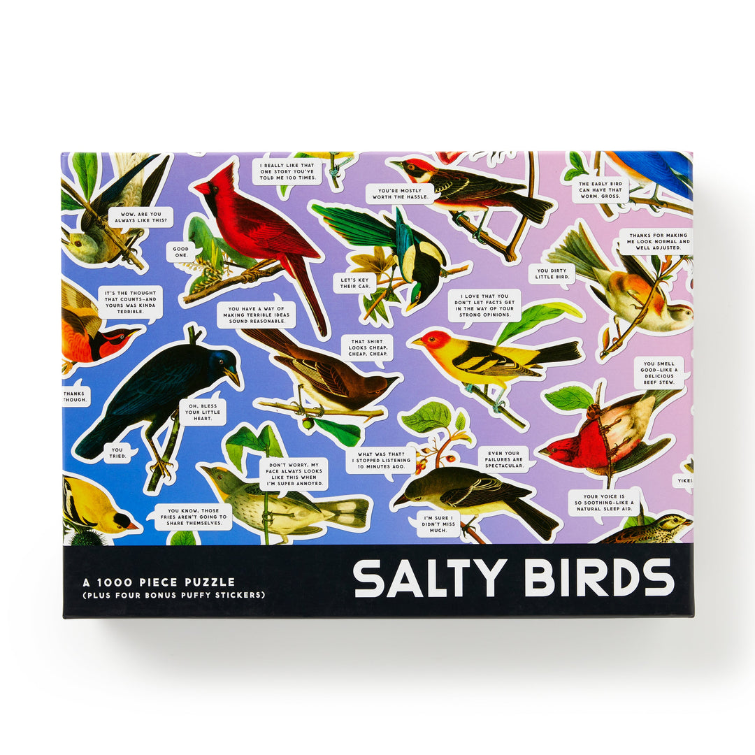 The Brass Monkey Salty Birds 1000 Piece Puzzle features a lively bird collage on a purple background with witty speech bubbles and includes four bonus puffy stickers.