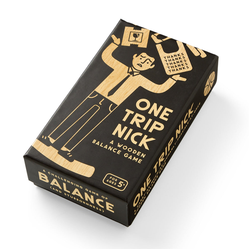 Brass Monkey’s One Trip Nick Wooden Balance Game comes in a rectangular black box with art of a man balancing groceries. For ages 5+, it’s described as a challenging game of balance and stubbornness.