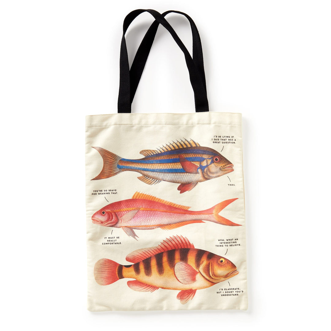 The Brass Monkey Judgy Fish Canvas Tote is a cream tote bag with black handles, showcasing three vintage-style, colorful fish illustrations, each labeled with fine black text.