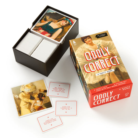 The Brass Monkey Oddly Correct Party Game is shown on a white background with its open box, illustrated vintage art cards, and red-text prompt cards.