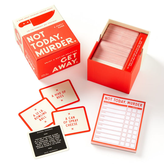 The Brass Monkey Not Today, Murder Game is shown with its red-and-white box, deck of cards, question sheets, and clue cards featuring quirky weapons like a 12 lb. bowling ball and a can of spray cheese.