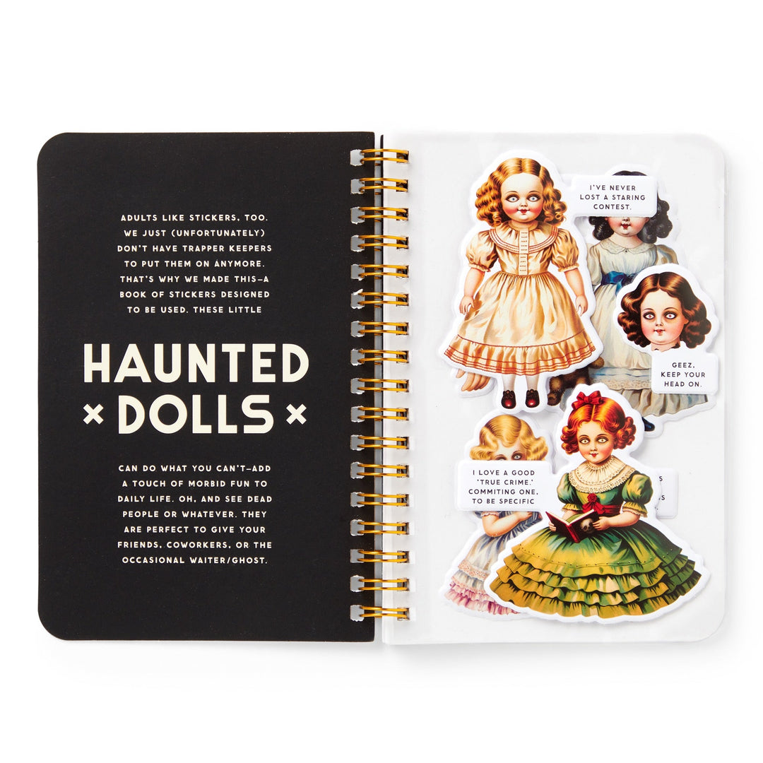 An open Haunted Dolls Sticker Book by Brass Monkey features a left page on using Haunted Dolls stickers and a right page with four oversized vintage-style creepy doll stickers, each with a humorous speech bubble.