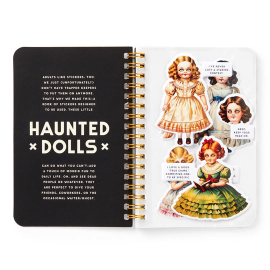 An open Haunted Dolls Sticker Book by Brass Monkey features a left page on using Haunted Dolls stickers and a right page with four oversized vintage-style creepy doll stickers, each with a humorous speech bubble.