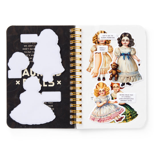 The Brass Monkey Haunted Dolls Sticker Book shows vintage-style doll stickers with speech bubbles on the right page, and matching empty silhouette slots for these ghostly friends on the left.