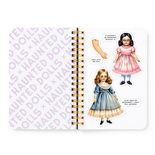 An open Brass Monkey Haunted Dolls Sticker Book shows HAUNTED DOLLS printed on one page, while the other features two vintage-style Haunted Dolls stickers, a severed hand sticker, and ghostly speech bubble messages.