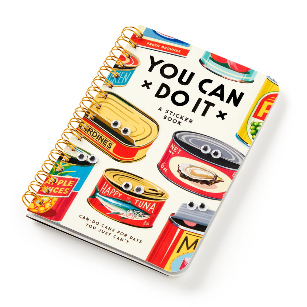 The Brass Monkey You Can Do It Googly Sticker Book is a spiral-bound collection with retro canned food illustrations, complete with googly eyes and smiles, all on a bright cover filled with colorful, playful stickers.