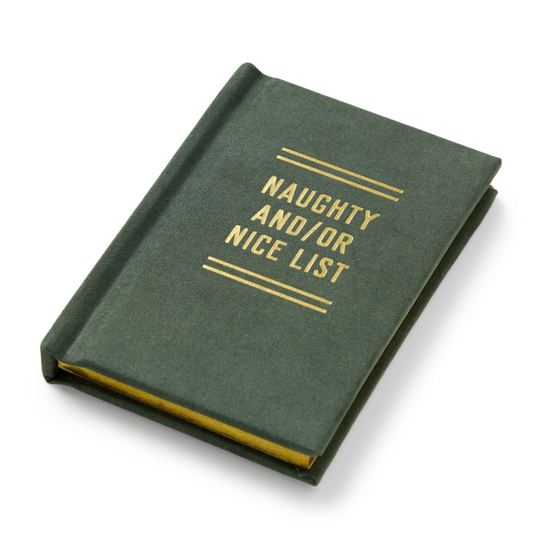 The Brass Monkey Naughty and/or Nice Tiny Diary is a green, pocket-sized Christmas journal with gold “NAUGHTY AND/OR NICE LIST” text on the cover, shown closed at an angle against a white background.