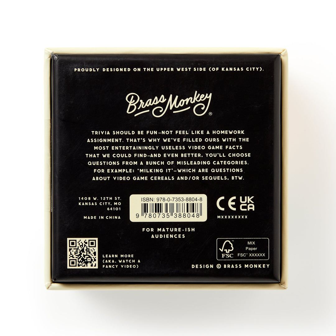 The back of a Brass Monkey Bizarre Video Game Trivia box features game details, barcode, age warning, logos, and the Kansas City, MO address. The packaging is mostly black with white and gold text.