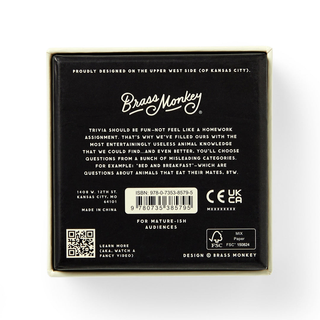 The back of the Useless Animal Trivia by Brass Monkey features the logo, a quirky game description, barcode, age and safety icons, plus location info—all in white text on a black background.