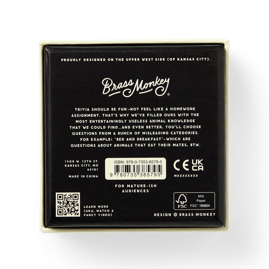 The back of the Useless Animal Trivia by Brass Monkey features the logo, a quirky game description, barcode, age and safety icons, plus location info—all in white text on a black background.