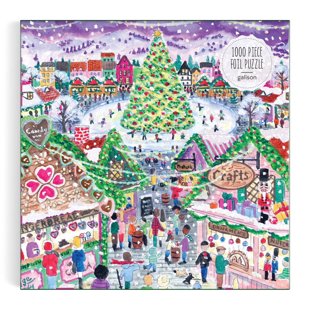 Illustration of a festive holiday market with colorful stalls, decorated tree, lights, shoppers, and snowy buildings; "Michael Storrings Holiday Village Market 1000pc Foil Puzzle in Square Box" by Michael Storrings is written in the corner.