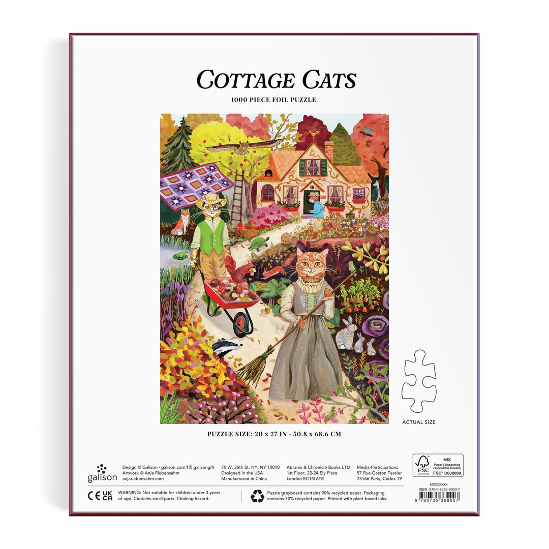 Back of the Anja Riebensahm Cottage Cats 1000 Piece Foil Puzzle box features illustrated cats in clothes enjoying autumn activities, set in a vibrant landscape with a cottage and garden. Text: Cottage Cats 1000 Piece Foil Puzzle.