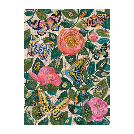 The Between the Blooms 1000 Piece Foil Puzzle by Christine De Carvalho features a vibrant botanical scene with butterflies and pink flowers among green leaves, enhanced by colorful foil accents for a lively nature-inspired challenge.