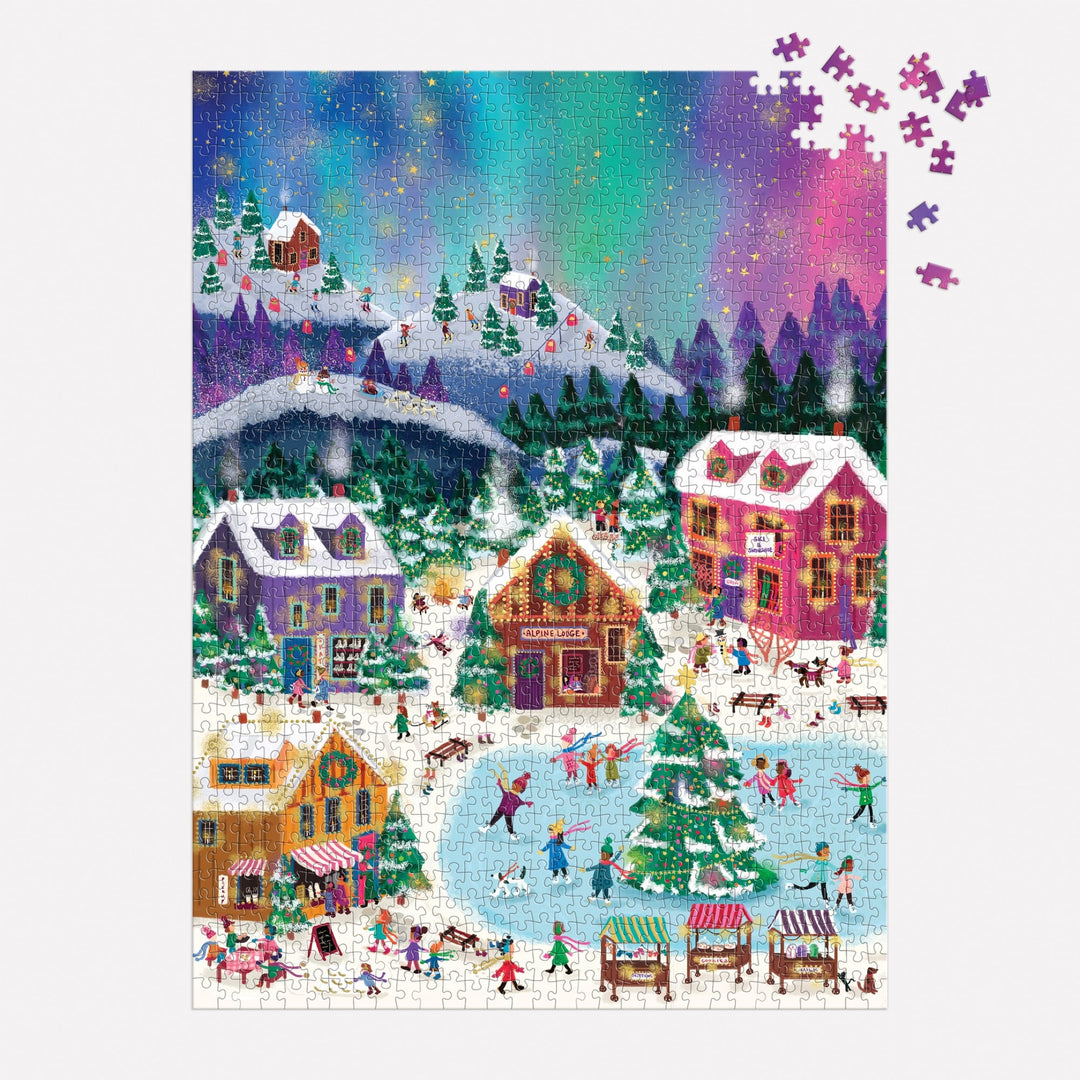 The Joy Laforme Northern Lights 1000 Piece Foil Puzzle features a festive winter village with ice skaters, decorated houses, pine trees, snowy market stalls, and a vivid aurora. Note: a small portion in the top right corner is missing pieces.
