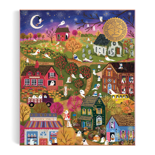 Enjoy the Joy Laforme Spooky Village 1000 Piece Foil Puzzle, featuring a whimsical dusk scene with autumn trees, charming houses, friendly ghosts, and a shining crescent moon and stars. Designed by Joy Laforme for an enchanting puzzling experience.
