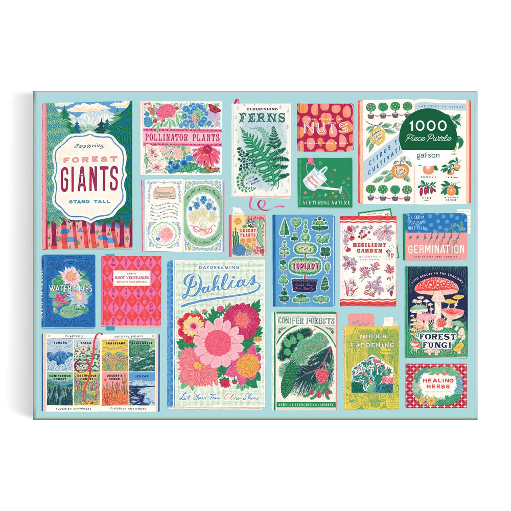 The Ever Upward Botanist Bookshelf 1000 Piece Puzzle by Emily Taylor features a vibrant collage of illustrated seed packets with flowers, plants, ferns, nuts, fungi, and playful botanical designs in various fonts.