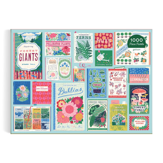 The Ever Upward Botanist Bookshelf 1000 Piece Puzzle by Emily Taylor features a vibrant collage of illustrated seed packets with flowers, plants, ferns, nuts, fungi, and playful botanical designs in various fonts.