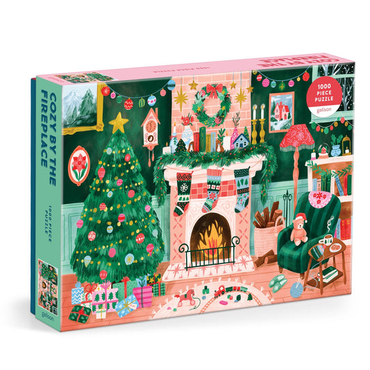 Cozy by the Fireplace 1000 Piece Puzzle by Carla Ellis features a festive Christmas scene with a decorated tree, gifts, stockings on a glowing fireplace, and comfy chairs—perfect for puzzle lovers seeking holiday cheer.