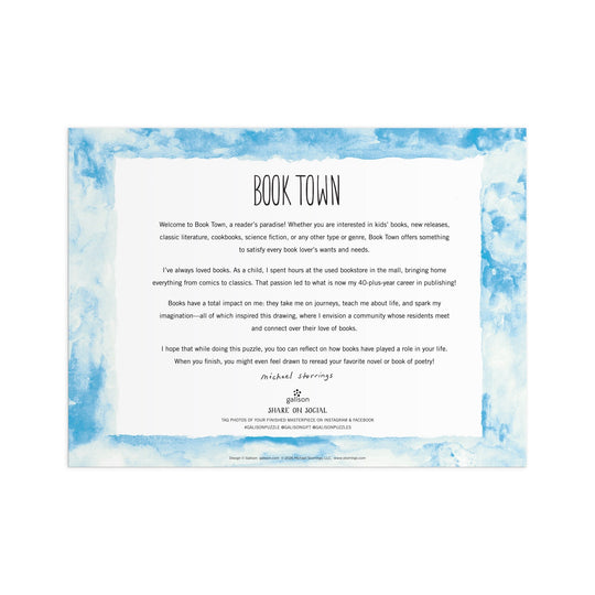 A decorative letter with a blue watercolor border and “Book Town” title welcomes readers to a book lover’s haven—like entering the world of the Michael Storrings Book Town 1000 Piece Puzzle by Michael Storrings, full of joy and literary inspiration.
