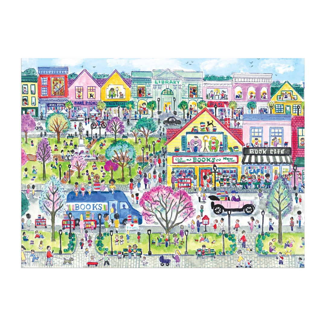 Experience the charm of Michael Storrings Book Town 1000 Piece Puzzle by Michael Storrings, featuring a vibrant park scene with people, a blue bookmobile, library, bake shop, book café, and blossoming trees—ideal for book lovers and puzzle fans.
